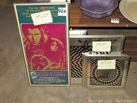 Framed Blade Runner movie poster next to two psychedelic mirrors labeled 17x17 and 12x12.