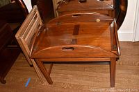 Wood butlers table folded and tray table visible to side