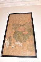 Frontal image showing the entire framed painting including white egrets and lotus leaves and flowers.