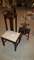 Photo showing the full lot with lamp, plant stand, foot stool, and table arranged together
