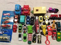 Top view photo of the collection showing various vintage toy vehicles including Hot Wheels, Majorette, Tonka toys, motorcycles, and cars.