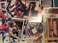Photo showing a variety of hockey cards with players in action and team photos, highlighting Pro Set cards with some O-Pee-Chee cards visible.