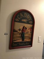 Full view of the wood art plaque titled 'Caddy' with a 3D golfer figure and painted golf course background in frame