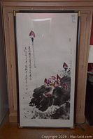 Full view of framed Asian style watercolour painting featuring lotus flowers and calligraphy.