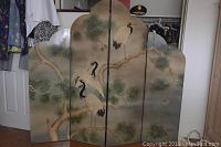 Full front view of the four-panel folding screen with painted cranes and pine trees.