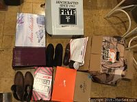 Lot overview with all shoe boxes and some visible shoes on floor, showing brand variety and original packaging