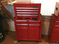 Full view of red Waterloo Shop Series rolling tool chest showing 11 drawers on caster wheels
