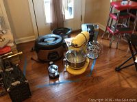 Wide view of lot including KitchenAid mixer, two slow cookers, Keurig brewer, K-Cup carousel, and small grinder