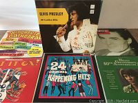 Photo of a selection of used LP vinyl record albums including Elvis Presley - 20 Golden Hits and Winchester Cathedral among others showing album cover designs and condition.