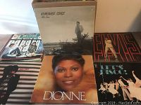 Several LP record covers including Homemade Songs by Milton Brown, Dionne by Dionne Warwick, Elvis Presley, and others