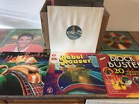 View of selected LP covers from the lot including Rebel Trouser, Heat Tracks, Block Busters, and a plain sleeve with visible vinyl record.