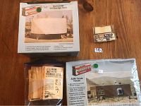 Walthers Cornerstone kit boxes for ADM Scale House and Horizontal Oil Storage Tank, assorted Kadee coupler packages.