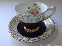Angle showing cup and saucer from above with floral interior of cup visible.