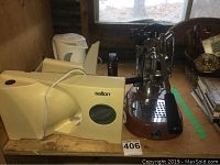 Salton meat slicer on left, La Pavoni espresso machine on right, white kettle in background