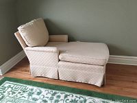 Side profile of the chaise lounge showing seat extension, armrest and loose back cushion