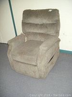 Front view of the Okin electric recliner lift chair, showing upholstery and overall condition.
