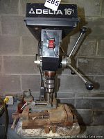 Front view showing drill head, table, column and mounted vise