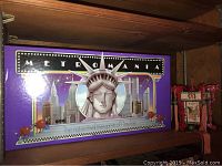 Metromania board game box with Statue of Liberty and cityscape image