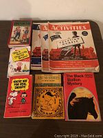 Vintage childrens books including The Adventures of Tom Sawyer and activity books