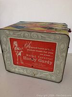 Bottom of the tin toy showing label with brand, series and description of music function.