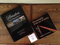 Photo of front covers of the two art books, showing titles and cover images.