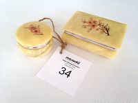 Both alabaster boxes side by side with auction tag number 34 visible.