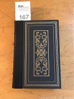 Front cover of the Franklin Library book showing black leather with gold gilt tooled designs