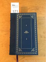 Front cover of Franklin Library leather bound book featuring blue leather with gilt tooling and decorative border.