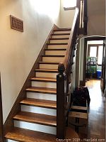Installed oak staircase showing full run of 13 steps and handrail