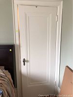 Full view of painted interior door in frame