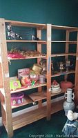 Frontal view of the wooden six-shelf unit showing six shelves with various small decor items displayed (not included).
