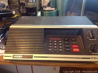Front view of the Uniden Bearcat 210X scanner showing keypad, speaker grill, and control knobs.
