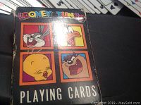 Looney Tunes playing cards box with Bugs Bunny, Daffy Duck, Tweety Bird, and Taz artwork