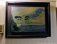 Framed oil painting depicting trees by a body of water, showing the full artwork and frame.