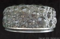 Side view showing the textured bubble pattern in clear glass with no defects.