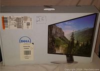 OEM shipping box with Dell branding, packing slip label visible