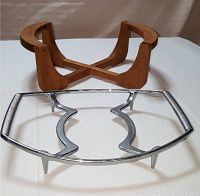 Wooden and metal trivets displayed together on white surface