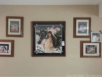 View of the wall showing the framed Maija print among other artworks to illustrate scale and framing style.