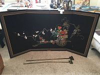 Full view of the four-panel Japanese folding screen with floral embroidery and brass hangers placed in front.