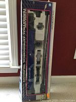 Boxed Edu Science terrestrial astronomical telescope set with components visible through packaging window including telescope tube, eyepieces, and tripod.