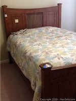 Wooden queen size bed headboard and bedding showing top and sides