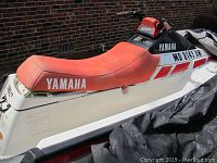 Port side view showing hull, red seat and console