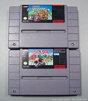 Top view showing the front labels of the two Super Nintendo cartridges: Super Mario Kart and Monopoly.