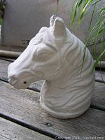 Side view showing horse head details and right ear irregularity