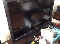 Full view of the Vizio 42 inch flat screen TV on stand, showing screen and bezel.