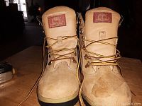Front view of Timberland boots size 6 showing the lace-up closure, Timberland logo patch on the tongue, and toe area.
