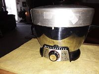 Westinghouse pressure cooker showing the front dial timer and indicator light on a yellow cloth.