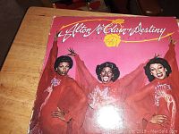 Front cover of the Alton McClain & Destiny vinyl record album titled "More of You" showing the group in red outfits on a pink background.