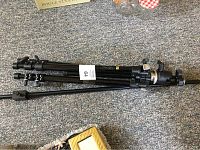 Black aluminum tripod with adjustable legs and pan-tilt head