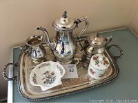 Full view of Gorham silver tea set and tray with Wedgewood Kutani Crane porcelain pieces arranged together